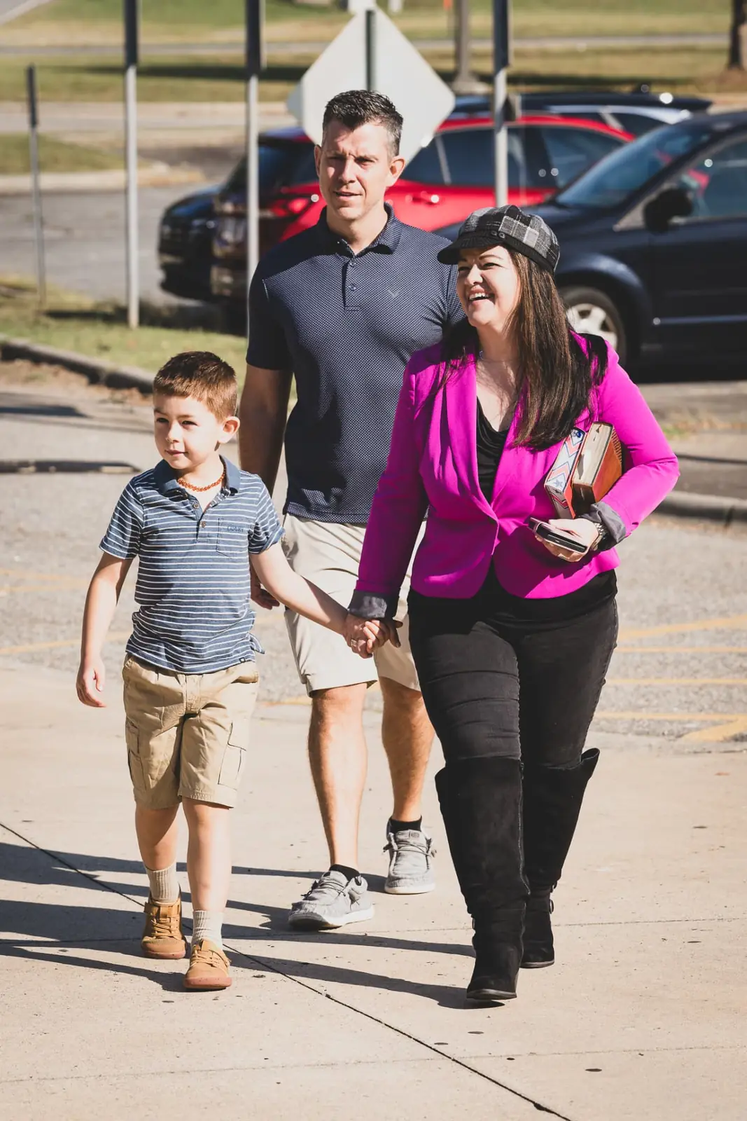 A family walking into Sunday service together