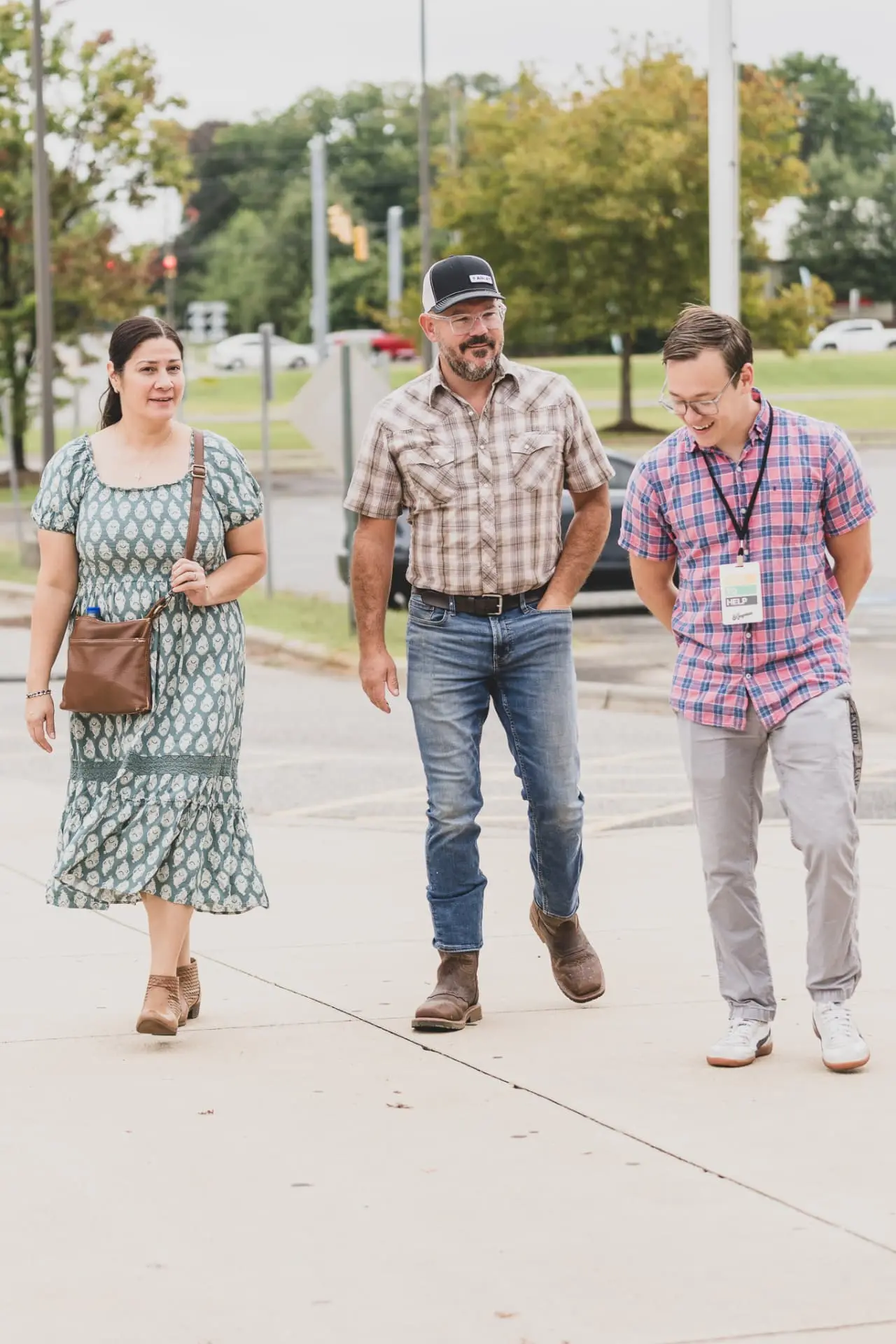 Three guests walking up to the main entrance on a Sunday morning